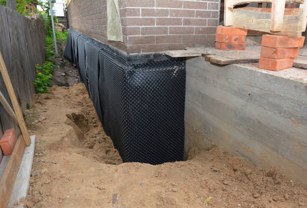 Happy homeowners after waterproofing job in Canal Winchester